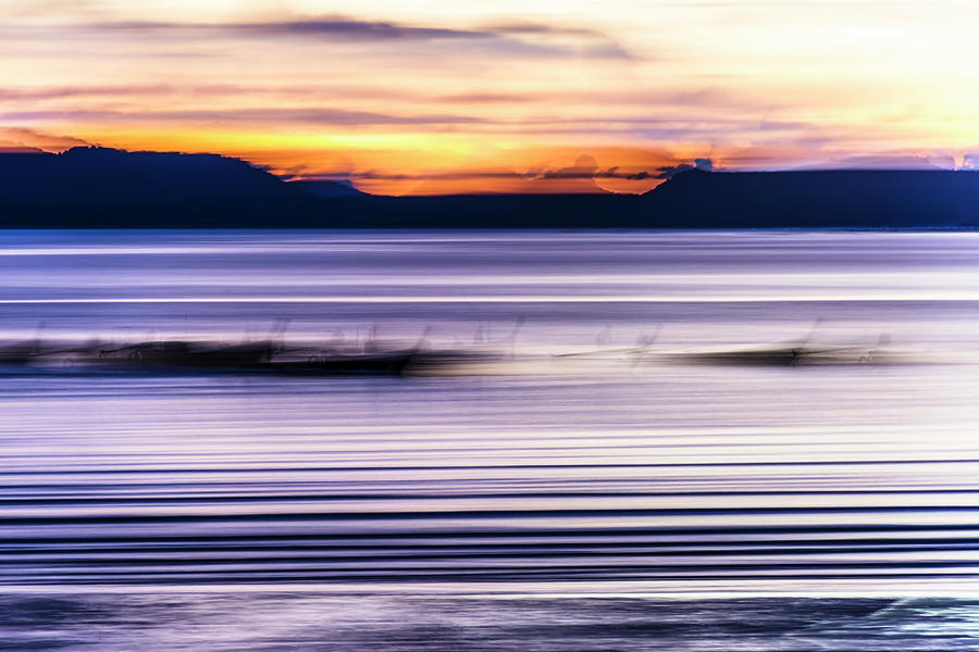 Ghostly Boat Blur At Sunset Photograph