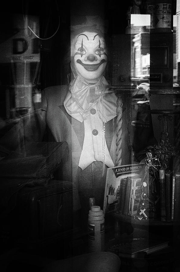 Ghostly Clown in an Antique Shop Window Display Black and White Photograph by Shawn OBrien