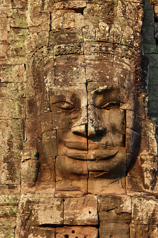 Giant stone face at Bayon Temple in Cambodia Photograph by Mikhail Kokhanchikov