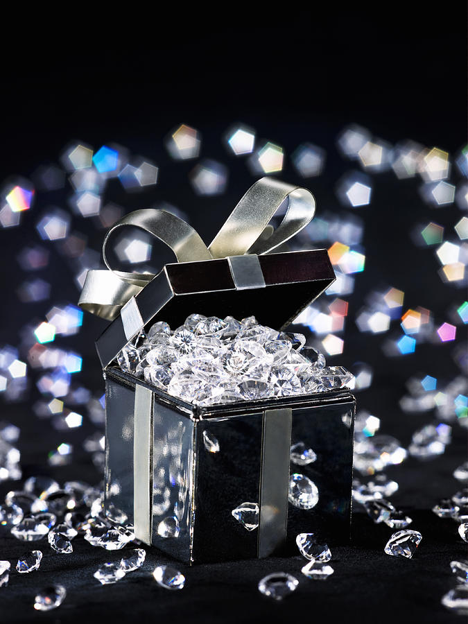 Gift box filled with diamonds, studio shot Photograph by Scott Kleinman