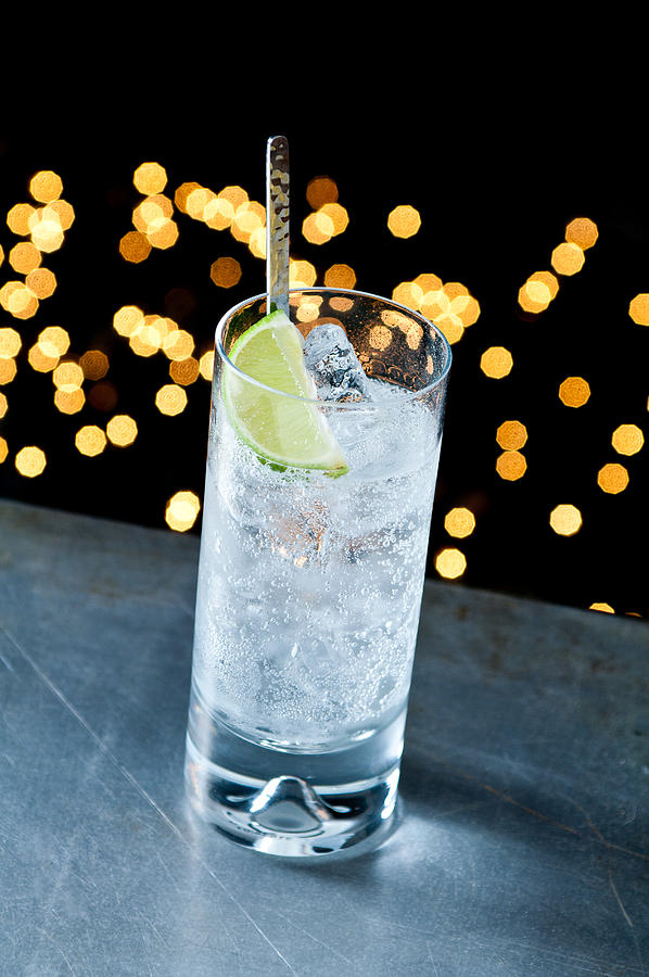 Gin and tonic in glass Photograph by Image Source