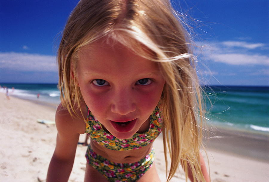 Girl (6-8) at beach, close-up Photograph by Allan Shoemake