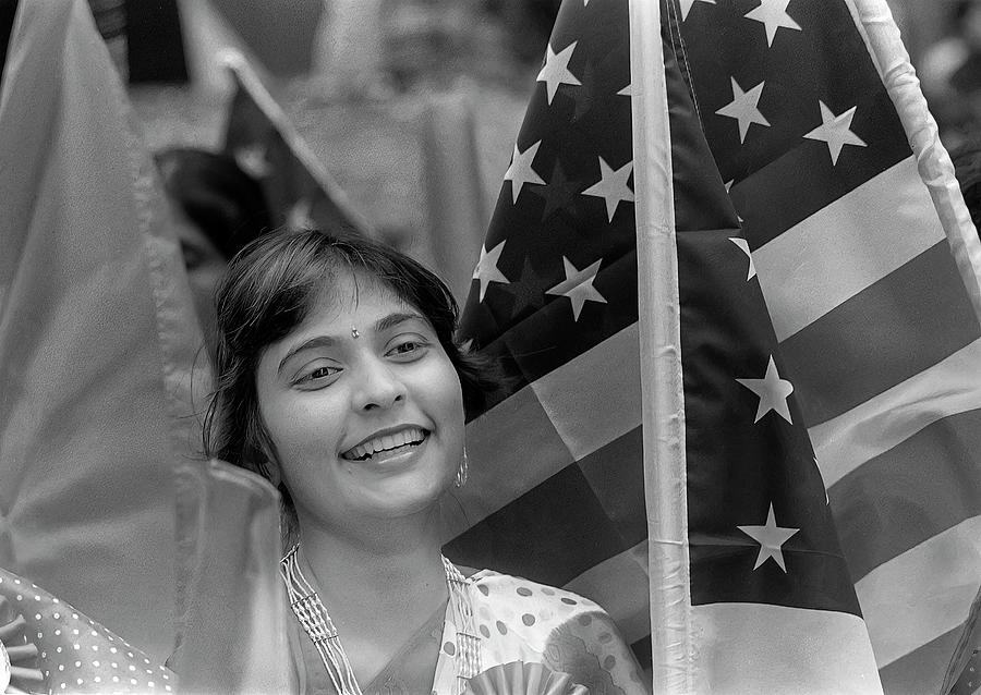 Girl and American Flags - India Day Photograph by Robert Ullmann