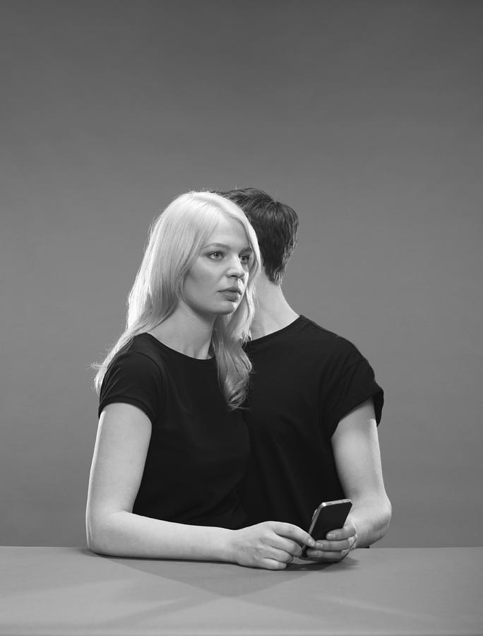 Girl and Boy hold a phone Photograph by Tim Macpherson