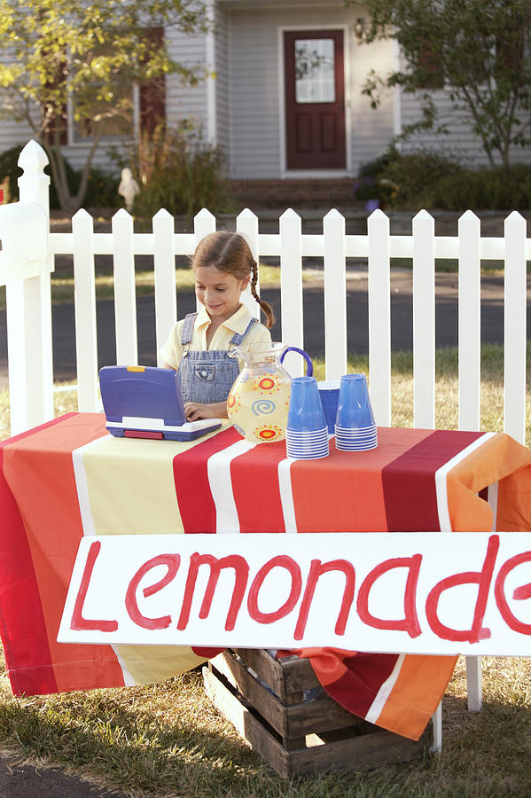 Girl at lemonade stand Photograph by Comstock Images
