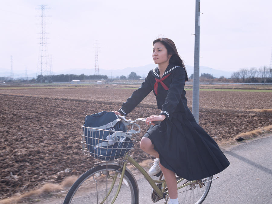 Girl cycling Photograph by Itaru Hirama