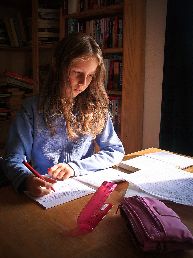 Girl doing homework Photograph by s0ulsurfing - Jason Swain