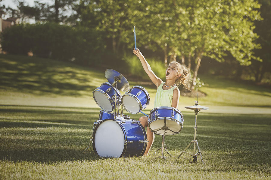 Girl drumming with wild abandon Photograph by Rebecca Nelson