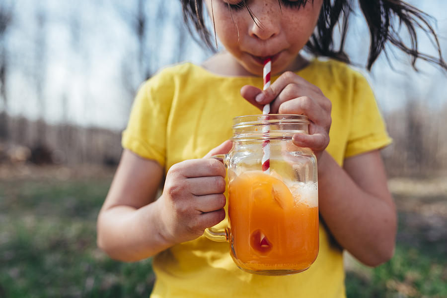Girl enjoying a summer drink Photograph by Elizabethsalleebauer