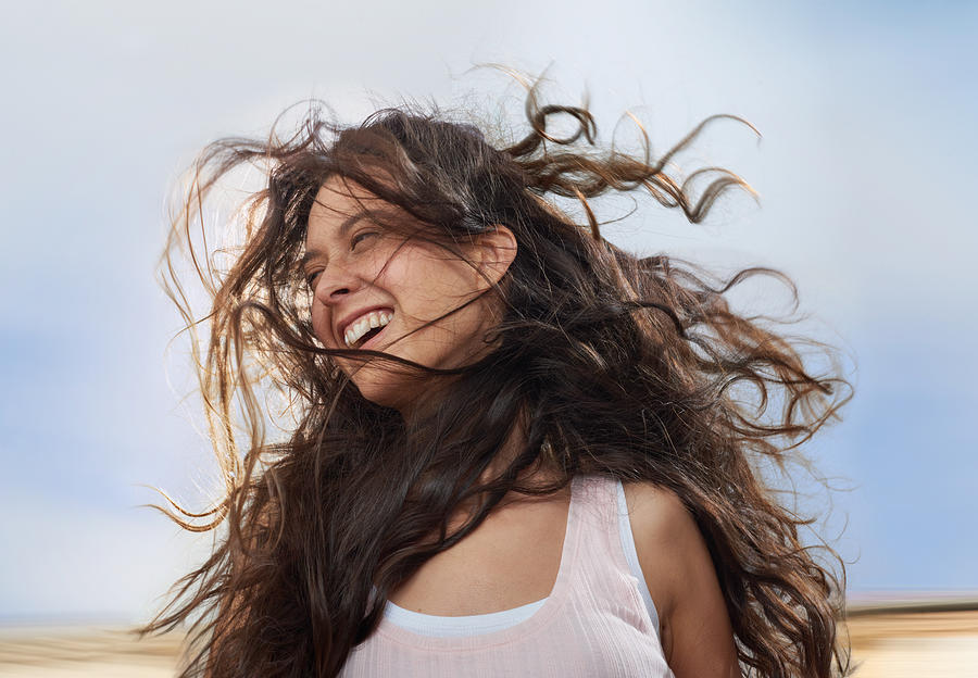 Girl enjoying wind in her hair while moving Photograph by Kai Wiechmann