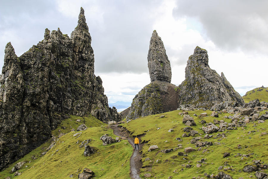 Girl hiking towards The Old Man of Storr, Scotland Photograph by Thomas Janisch