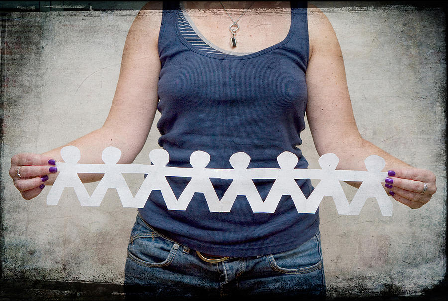 Girl  holding paper chain Photograph by SarahB Photography