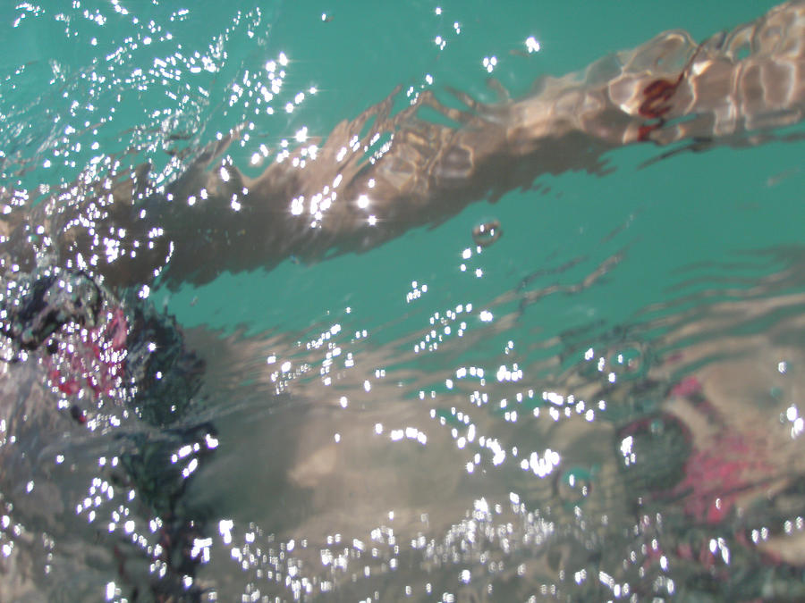 Girl in bikini swimming at Kailua Beach, Oahu Photograph by Melinda Podor