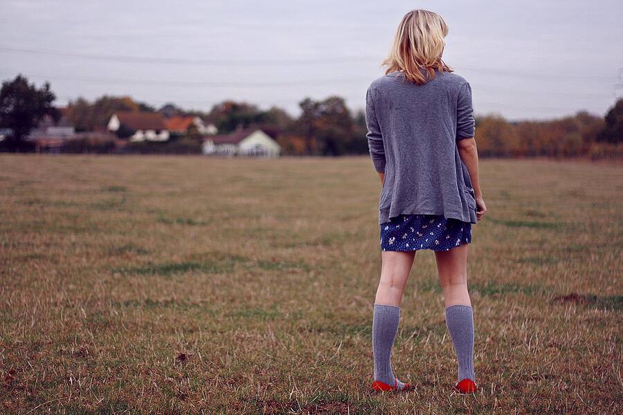 Girl in field with red shoes Photograph by Alexandra Cameron