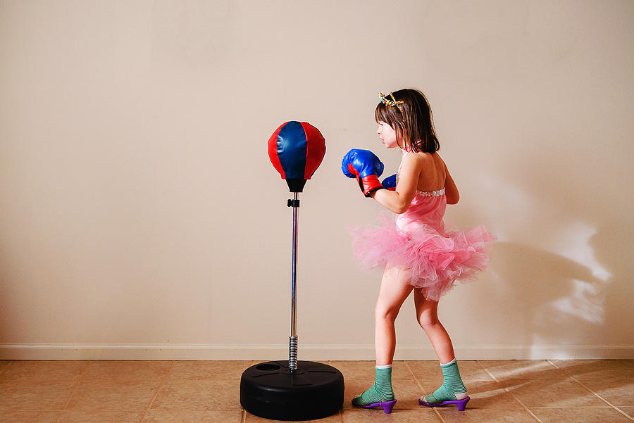 Girl in pink tutu and high heel shoes learning to box Photograph by Elizabethsalleebauer