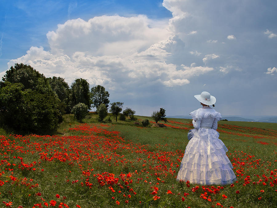 Girl in poppy field Photograph by Helmut Hess