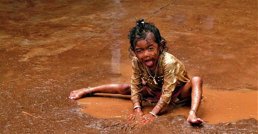 Girl in the puddle of brown water Photograph by Robert Bociaga