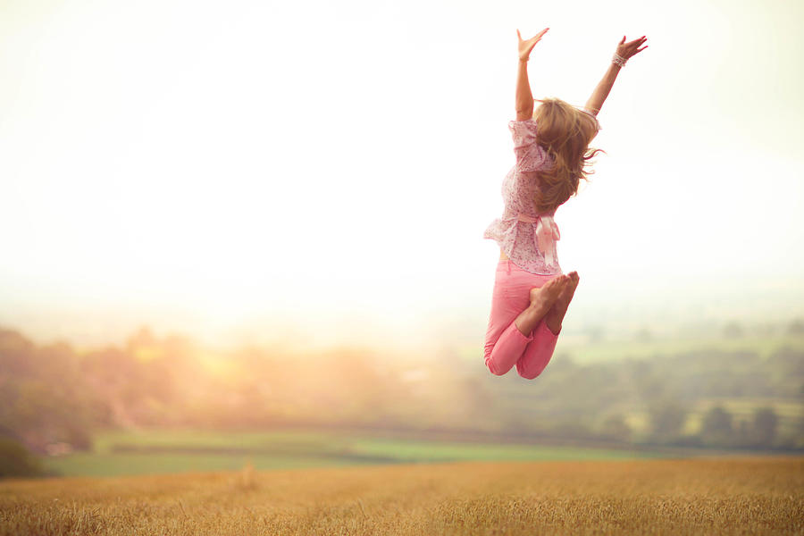 Girl Jumping in Harvested Wheat Field Photograph by Olivia Bell Photography