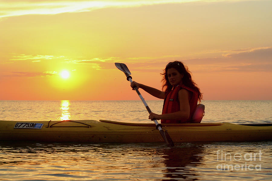 Nature Photograph - Girl Kayaking at Sunset by Christopher Purcell