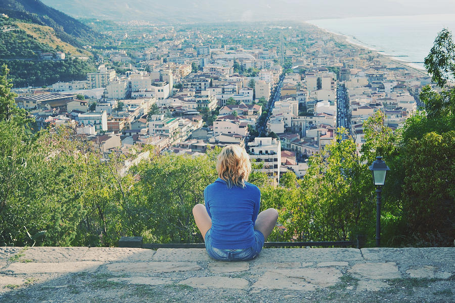 Girl looking at a panorama from the top of a hill Photograph by Elle Photography - Serena Pirredda