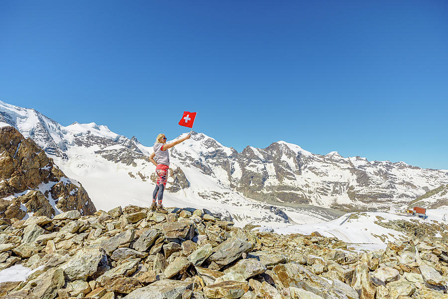 Girl on Diavolezza with swiss flag Photograph by Benny Marty