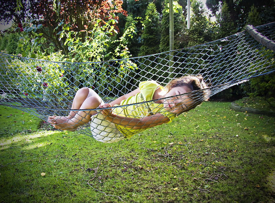 Girl sleeping on swing Photograph by Carol Yepes