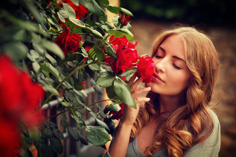 Girl Smelling Roses Photograph by Mammuth