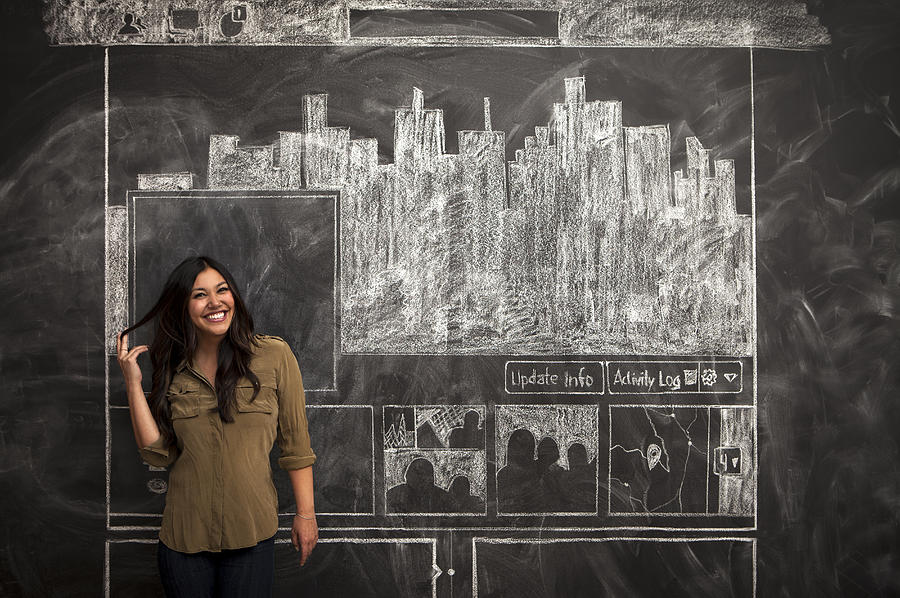 Girl smiles in front of facebook chalkboard Photograph by Justin Lewis