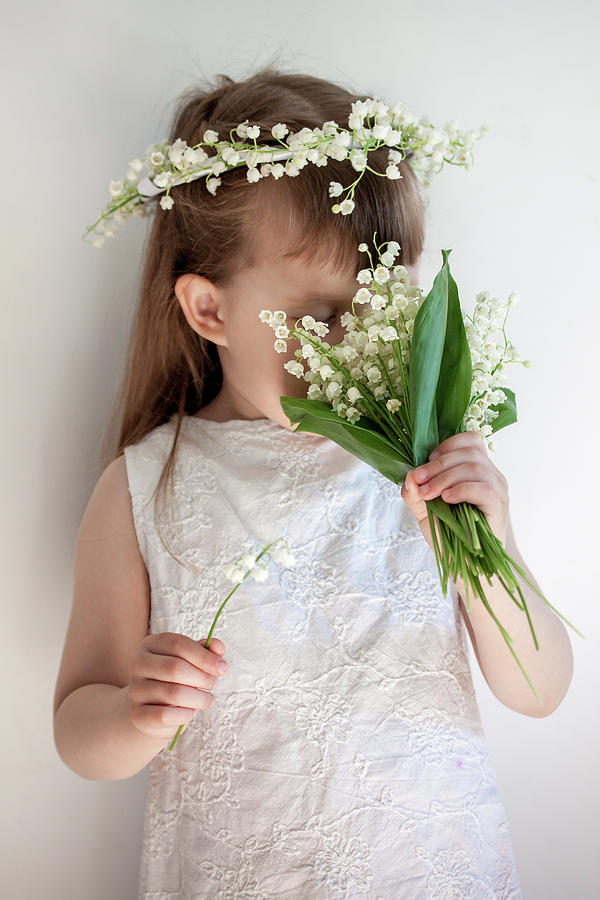 Girl Sniffing A Bouquet Photograph by Iuliia Malivanchuk