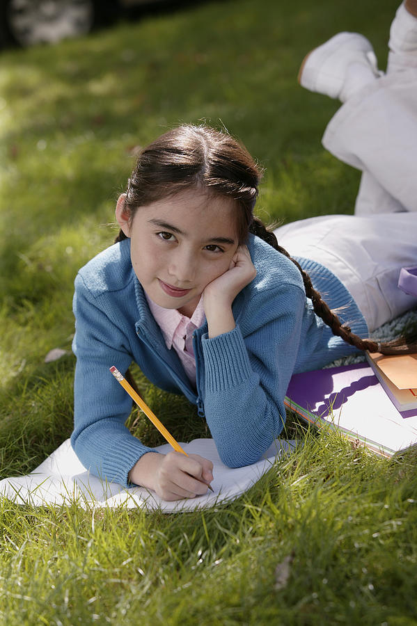 Girl studying outdoor Photograph by Comstock Images