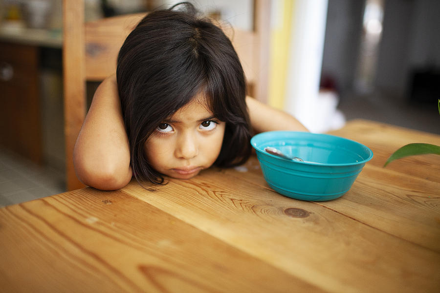 Girl Upset at Kitchen Table Photograph by Laura Olivas