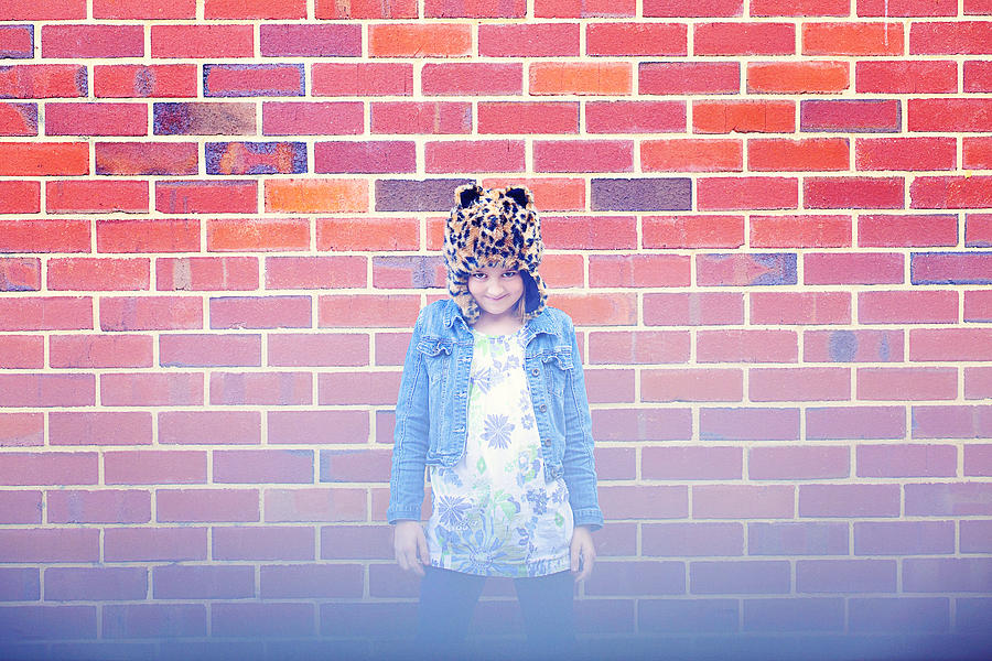 Girl Wearing a Hat Against A Brick Wall Photograph by Little Brown Rabbit Photography