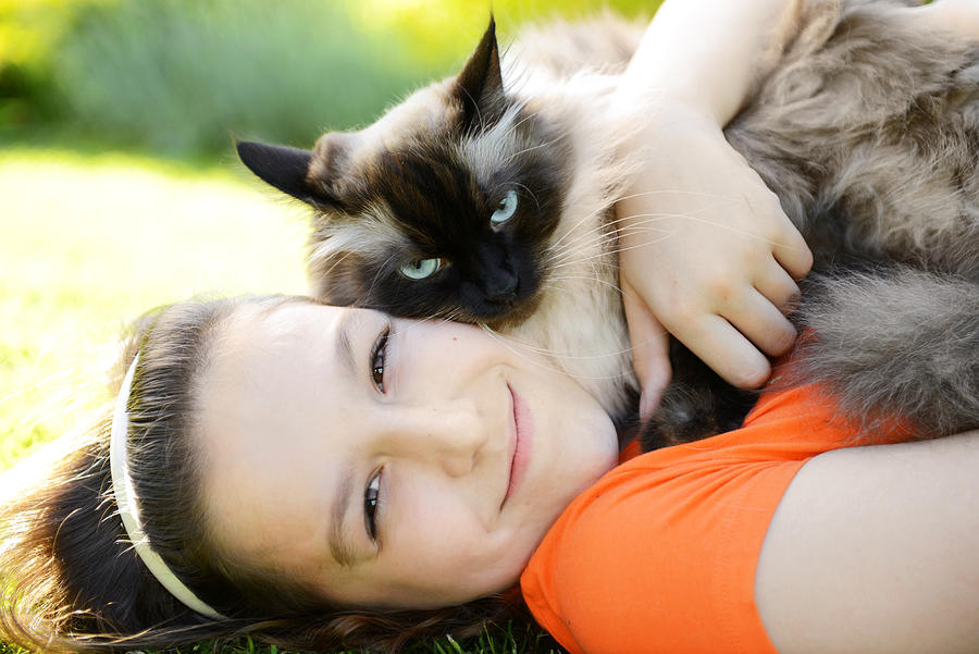 Girl with a cat Photograph by Elenaleonova