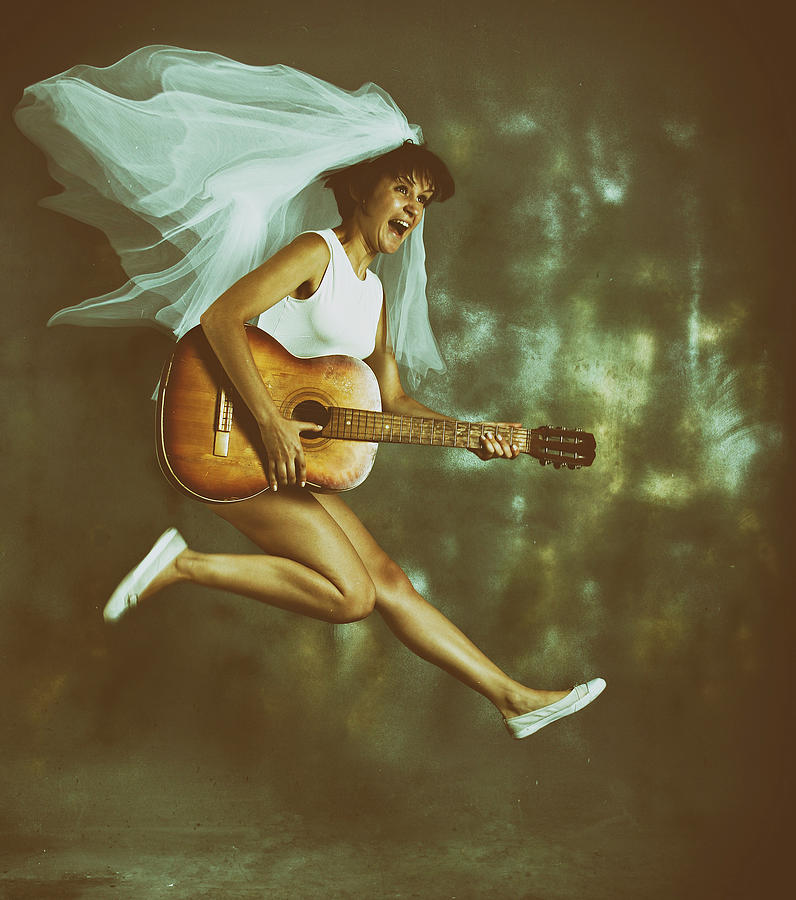 Girl with a guitar Photograph by Edward Galagan