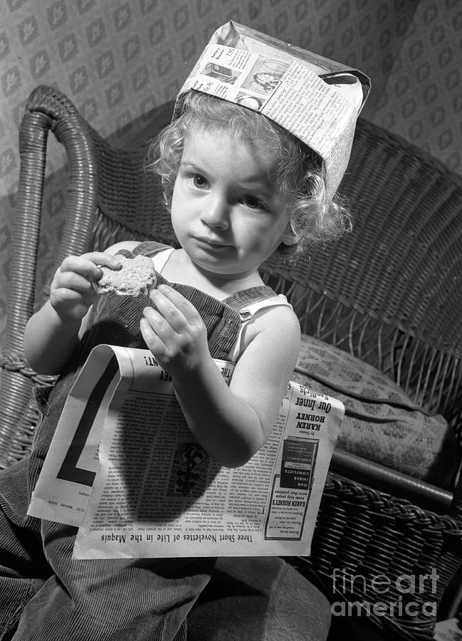 Girl with a newspaper hat Photograph by The Harrington Collection
