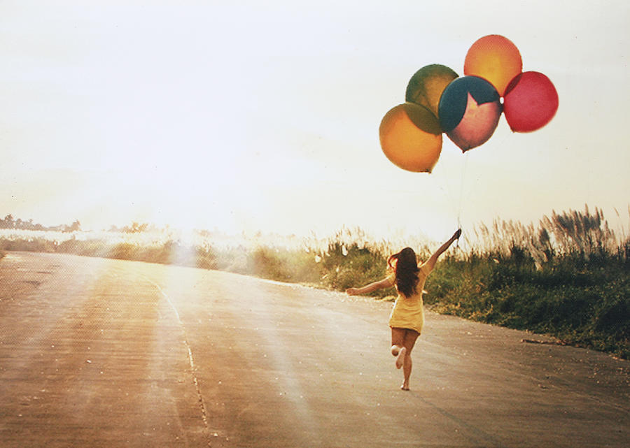 Girl with balloons Photograph by Anne Acaso