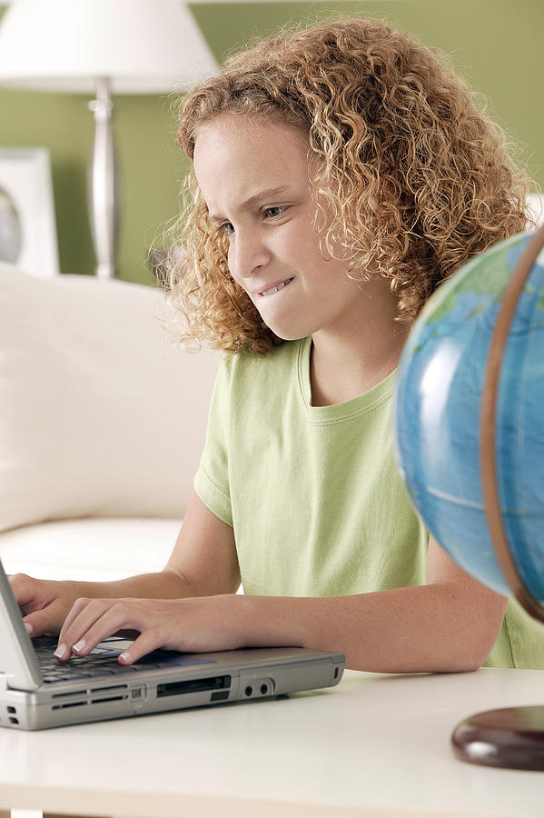 Girl with laptop Photograph by Comstock Images