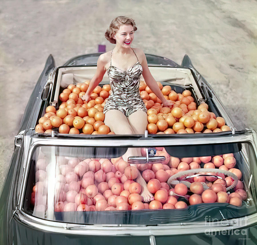 Girl with oranges in 1950s convertible Photograph by Retrographs