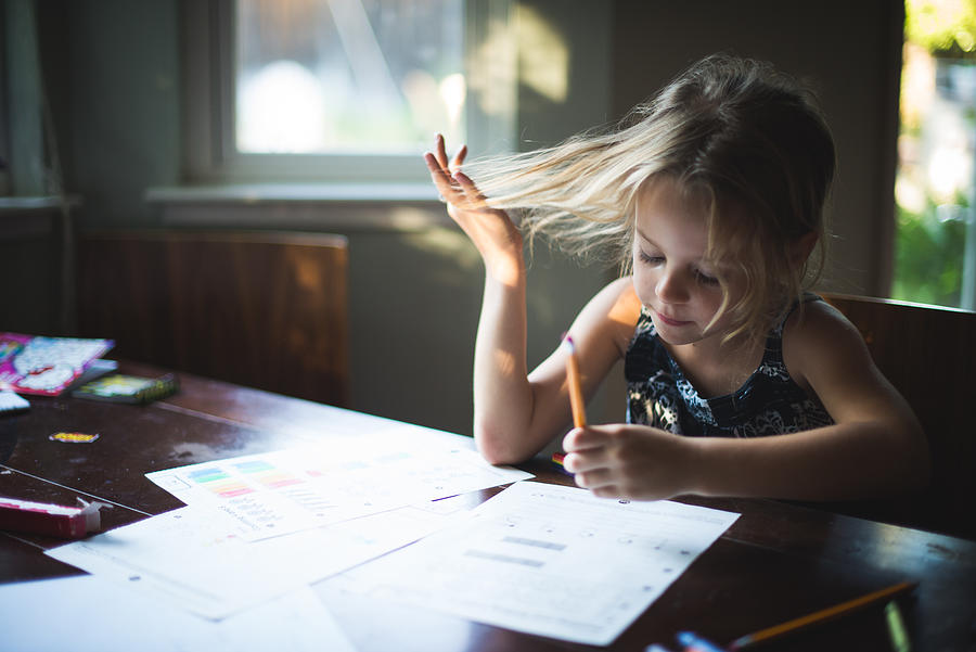 Girl with Pencil doing Homework Photograph by Teresa Short