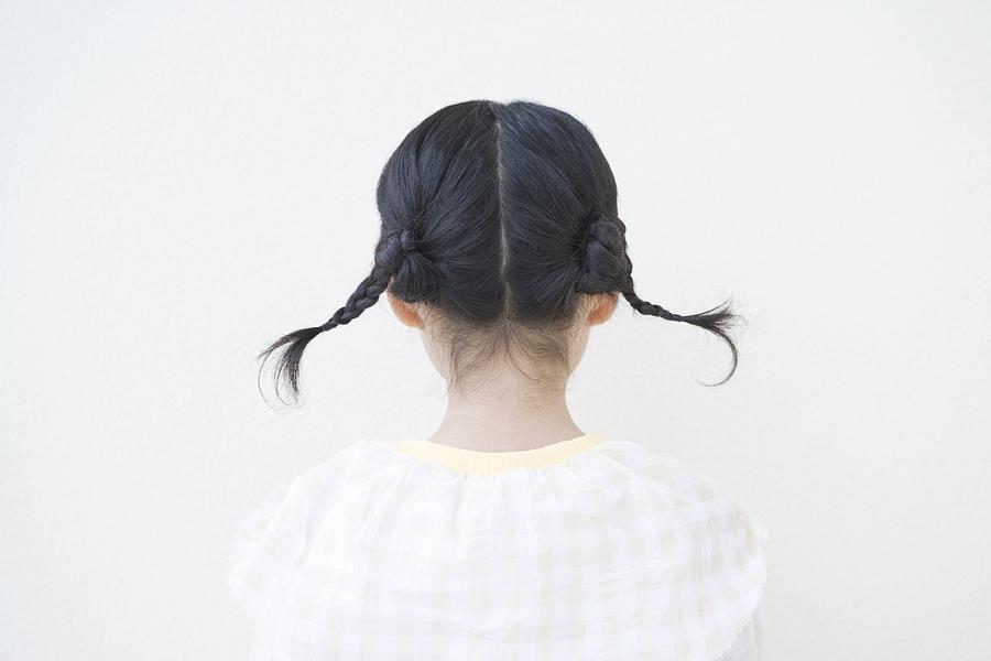 Girl with pigtails Photograph by Image Source