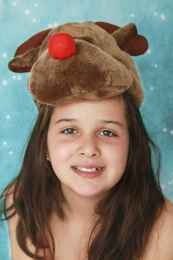 Girl with reindeer hat Photograph by Isabel Pavia