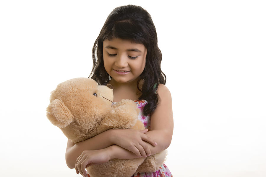Girl with teddy bear Photograph by IndiaPix/IndiaPicture