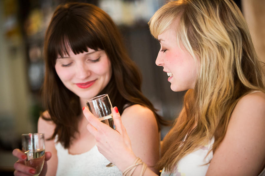 Girls drinking wine Photograph by Princigalli