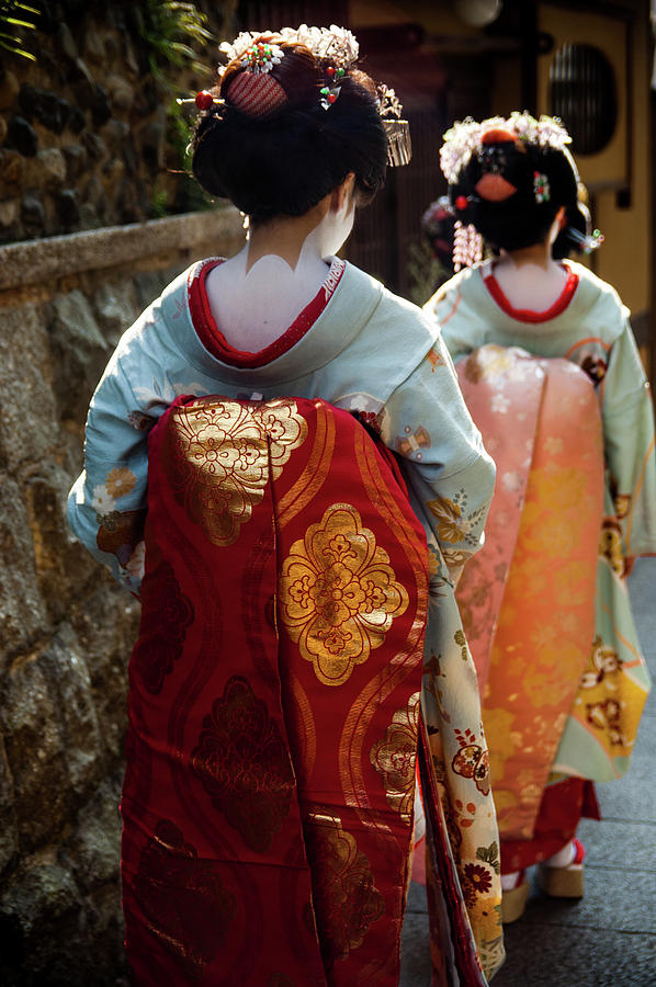 Girls in traditional Japanese kimono walking in the street. Photograph by Adelaide Lin