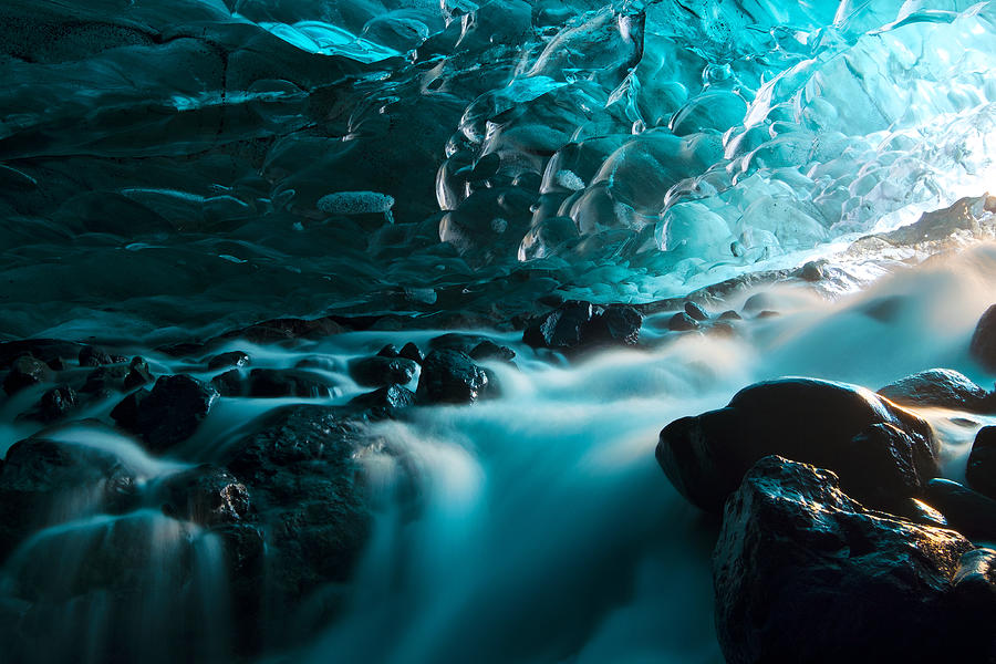 Glacial Ice Cave with Waterfall, Svinafellsjokull glacier Iceland Photograph by Natthawat