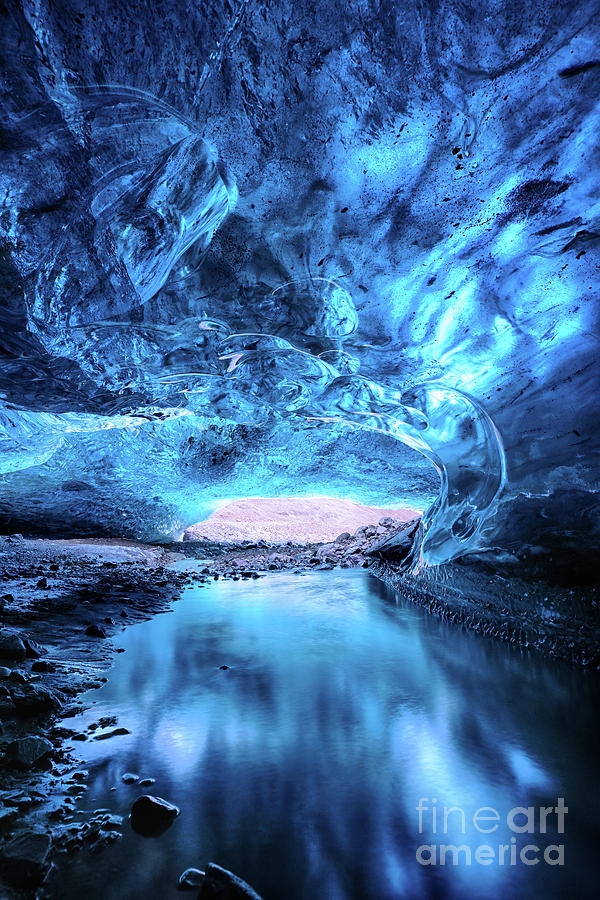 Glacial river flows through a blue ice cave. Part of the Vatnajo Photograph by Jane Rix