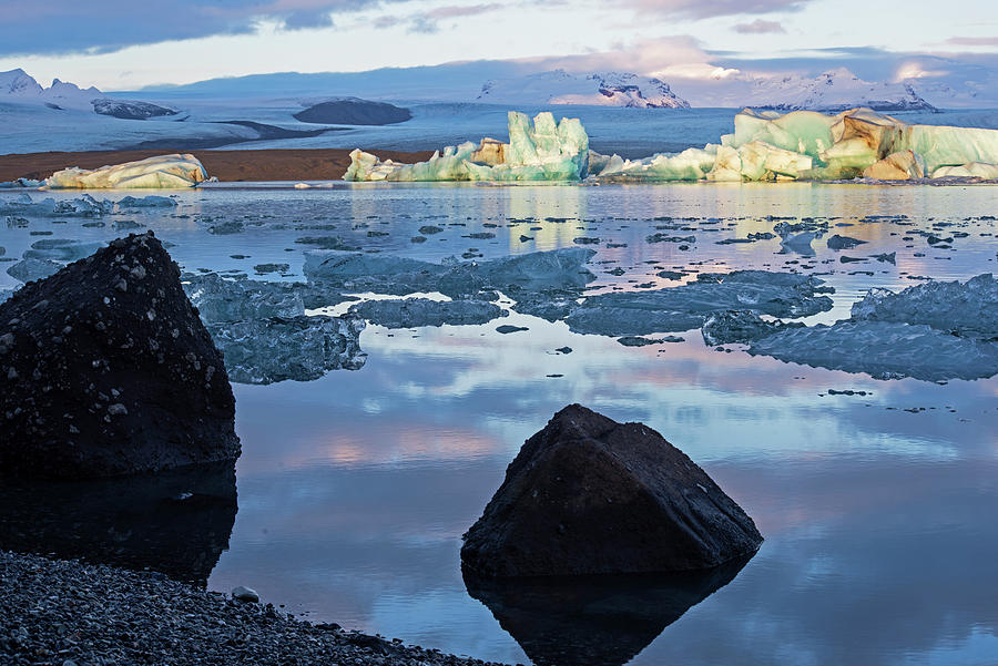 Glacier Lagoon Beautiful Blue Icebergs Jokulsarlon Iceland Black Rocks Photograph by Toby McGuire