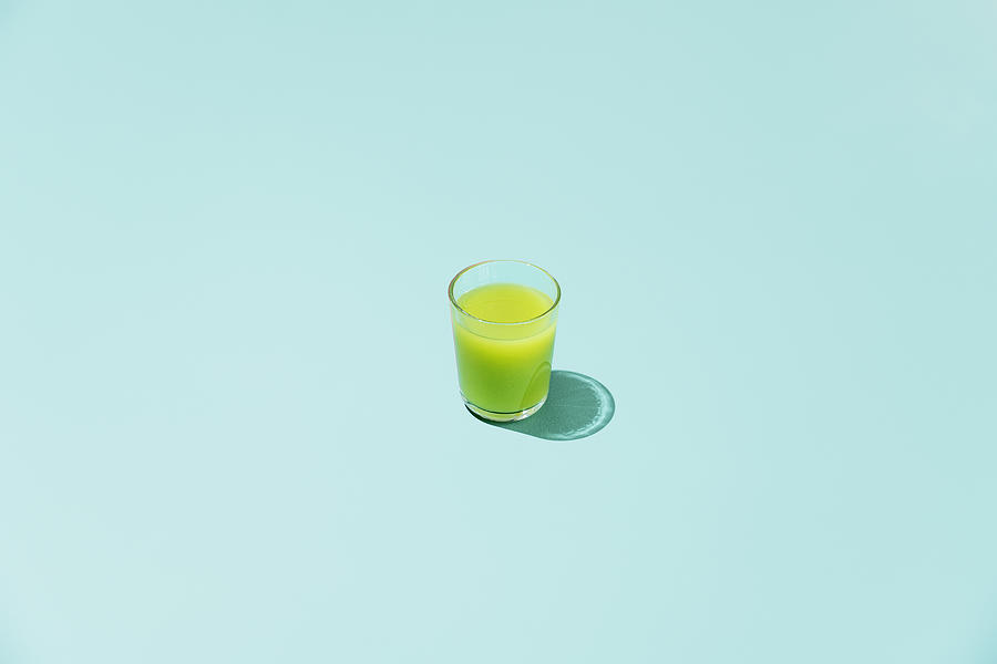 Glas of  apple,kiwi and cucumber juice Photograph by Daniel Grizelj