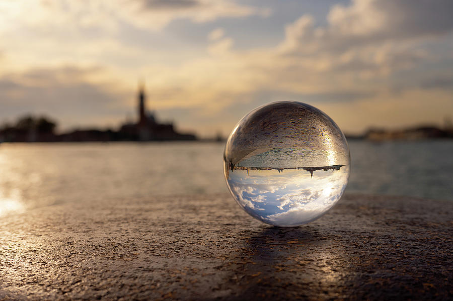 Glass ball lying on a bollard in Venice Photograph by Stefan Rotter ...