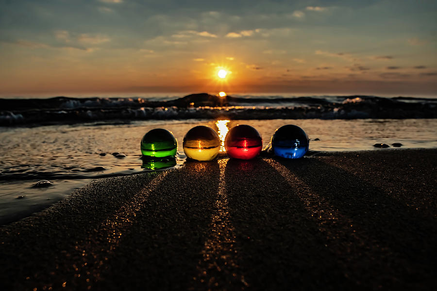 Glass balls in he waves at sun rise Photograph by Sven Brogren